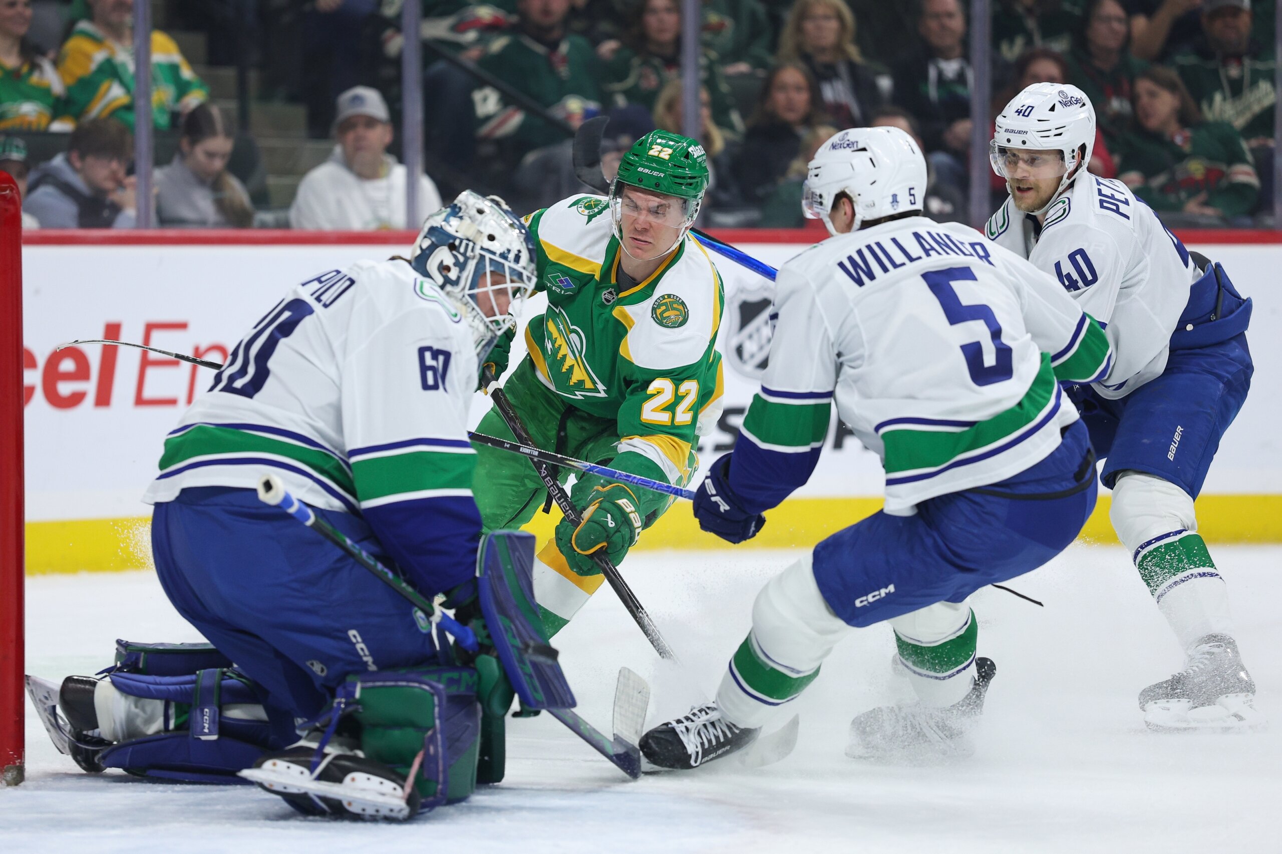 Wild clinch playoff berth; Canucks slump to last
