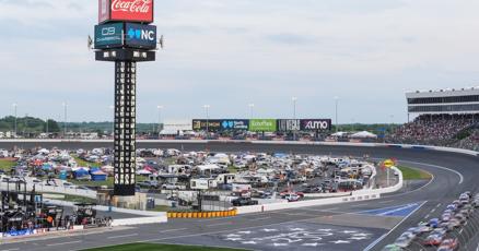 Suarez wins rain-shortened Coca-Cola 600 amid tribute