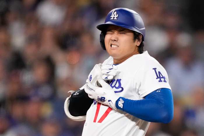 Ohtani hit by pitch but starts, homers and pitches