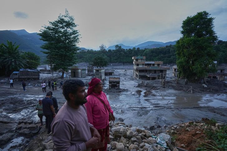 Heavy rain and flooding in north-central Japan strands people and vehicles