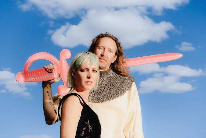 A married synth- pop duo used to go it alone. Now, they’re bringing friends to the fold.