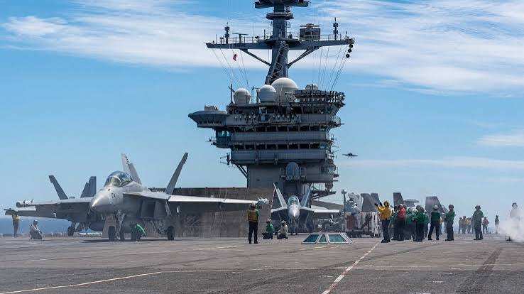 US Adds Carrier and 10,000 Troops to Mideast, Official Says